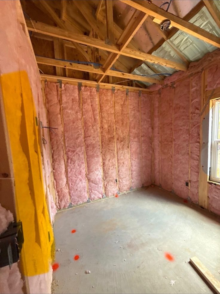 Wall batt insulation in a framed room